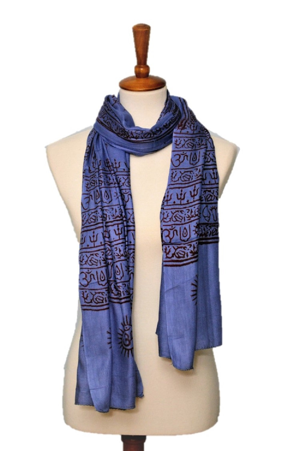 Blue patterned scarf on a mannequin with a white background