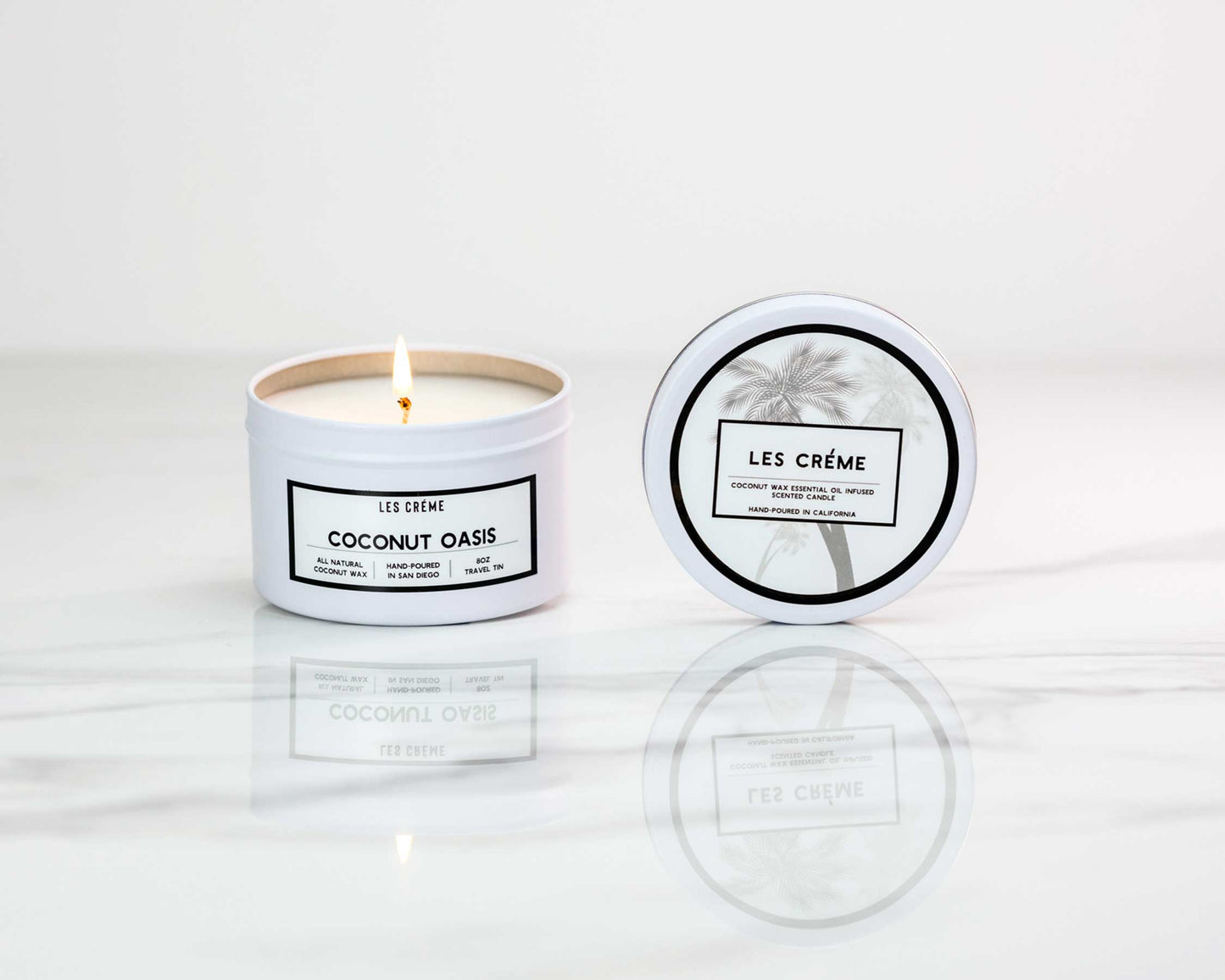 Candle with 'Les Crème' branding on a white background