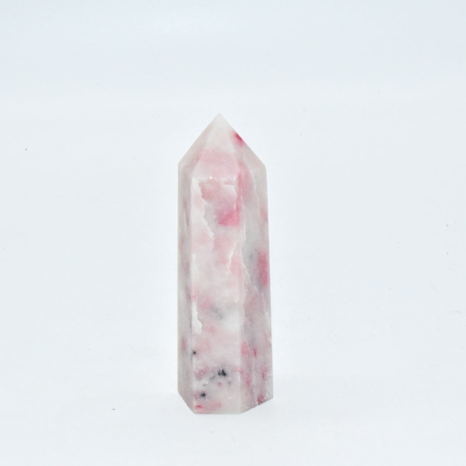 Marble-patterned crystal tower on a white background