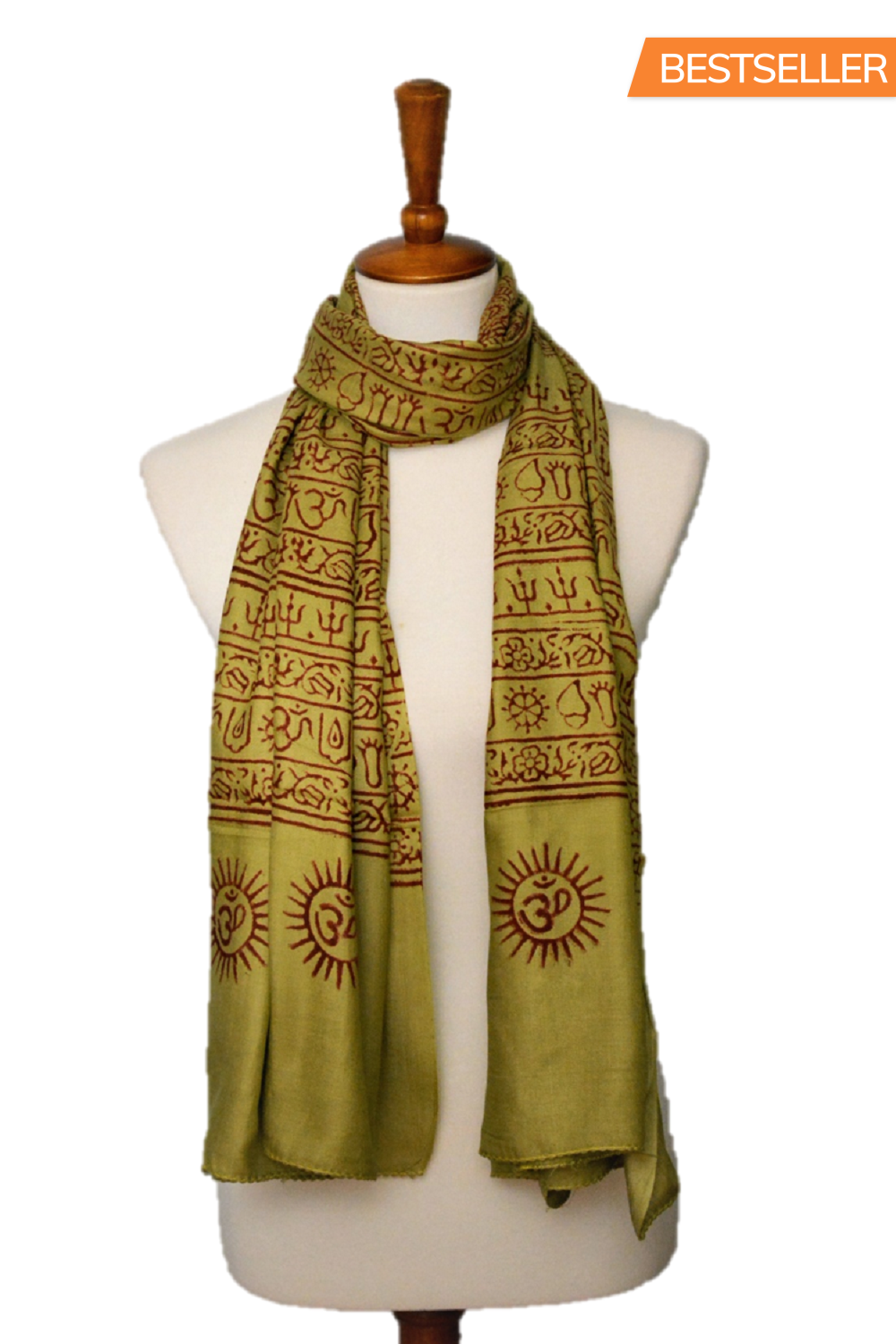 Green scarf with brown patterns on a mannequin against a white background