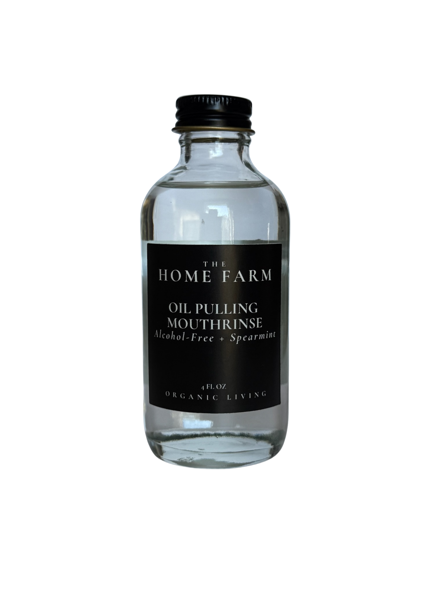 Clear bottle of oil pulling mouthrinse with black label on a white background