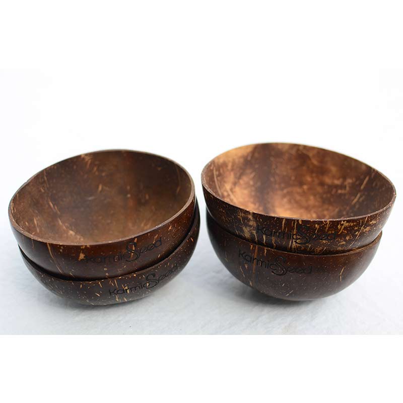 Two coconut bowls stacked on a white background