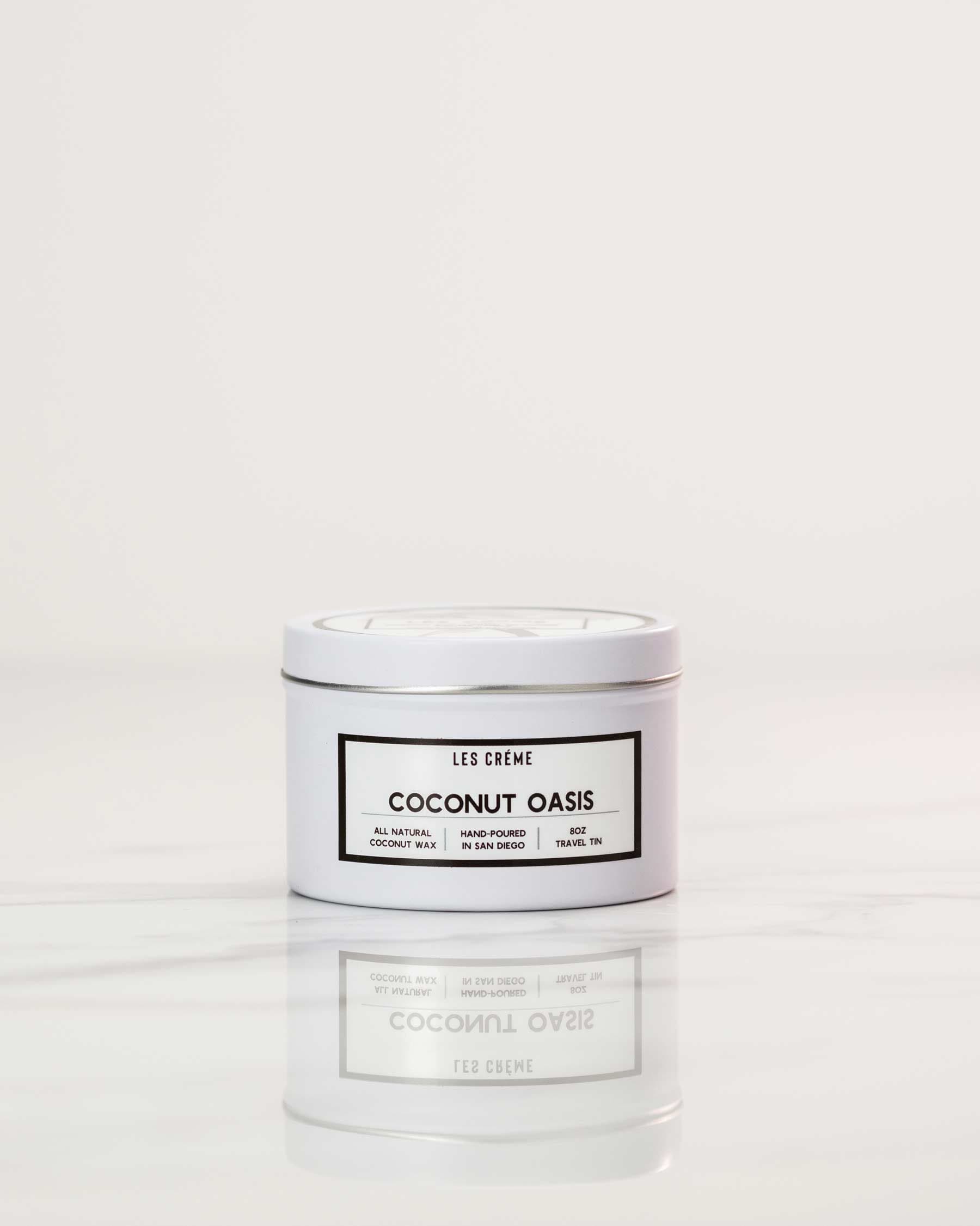 White candle labeled 'Coconut Oasis' on a white background
