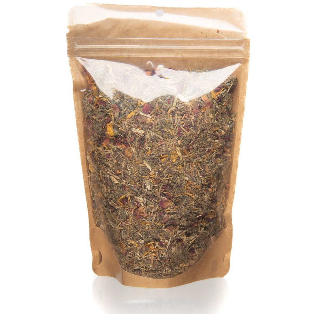 Brown paper bag with a clear window containing dried herbs on a white background