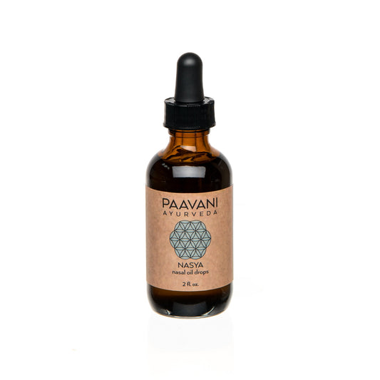 Brown glass bottle with a black dropper labeled 'Paavani Ayurveda' on a white background
