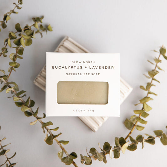 Eucalyptus and lavender natural bar soap with packaging on a light background