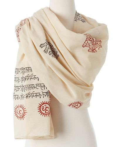 Beige scarf with red and black patterns on a mannequin