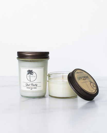 Two candles with labels on a white background