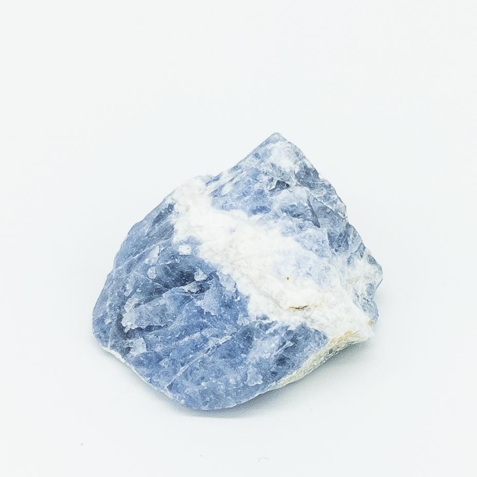 Raw sapphire crystal on a white background