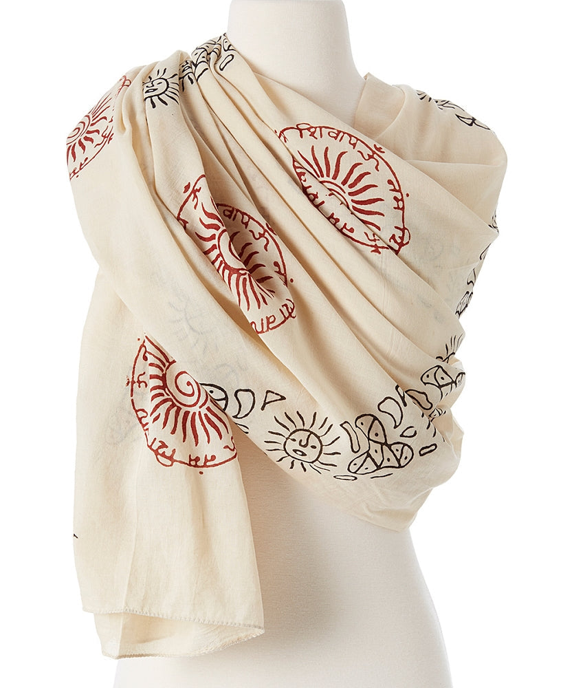 Beige scarf with red and black patterns draped over a mannequin on a white background