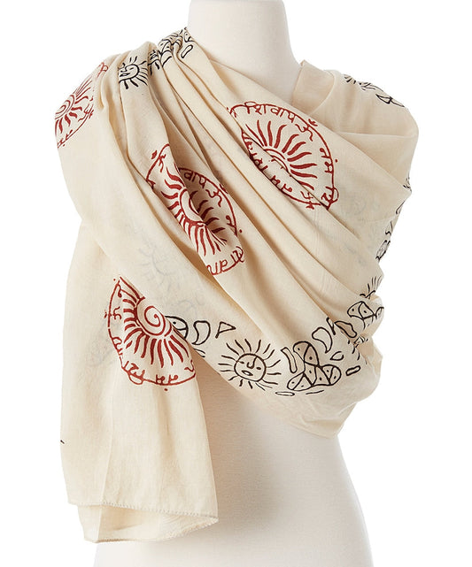 Beige scarf with red and black patterns draped over a mannequin on a white background
