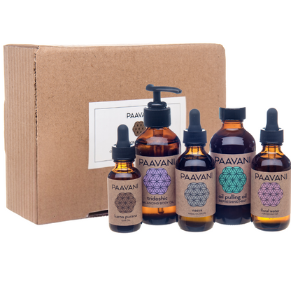 Set of PAAVANI Ayurveda oil pulling bottles with a cardboard box on a white background