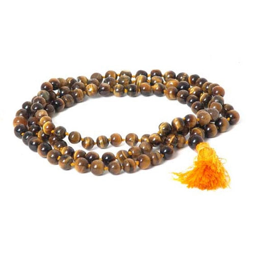 Mala necklace with brown beads and a yellow tassel on a white background