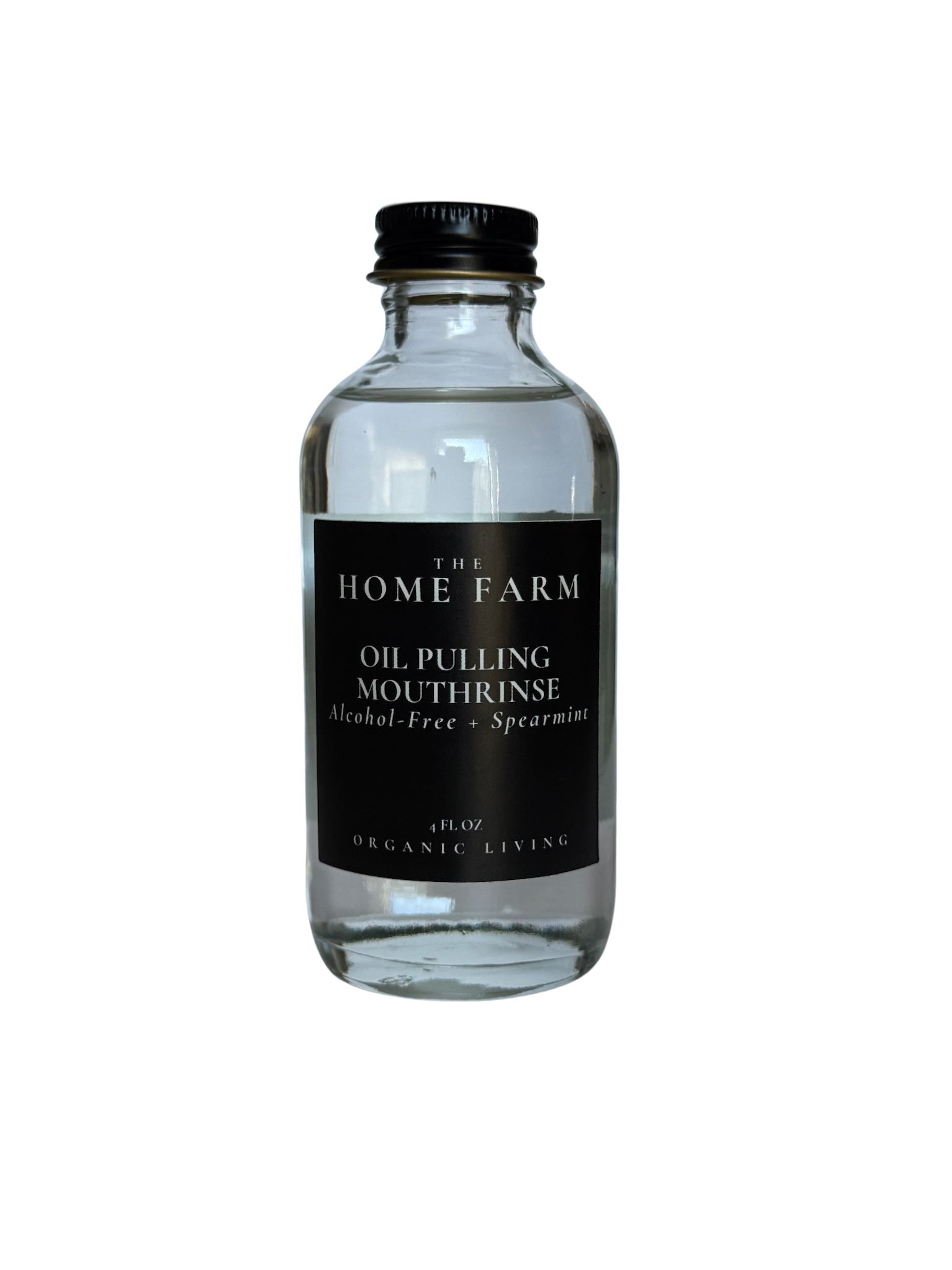 Clear bottle of oil pulling mouthrinse with black label on a white background