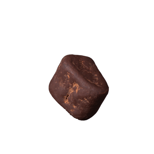 Brown chocolate truffle on a white background